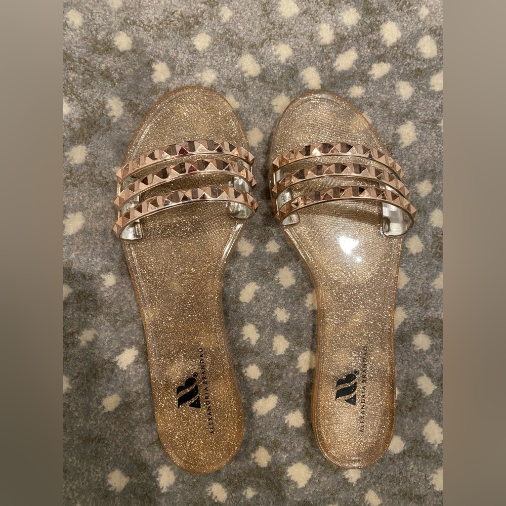 Flat sandals w/ rose gold straps & glitter bottoms, size 7, pristine condition.